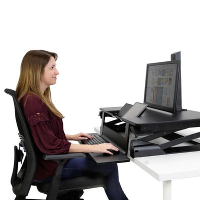 Ergotron WorkFit TLE Sit Stand Desktop Workstation Top Side View Sitting