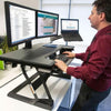 Ergotron WorkFit T Sit Stand Desktop Workstation Front Side View Standing