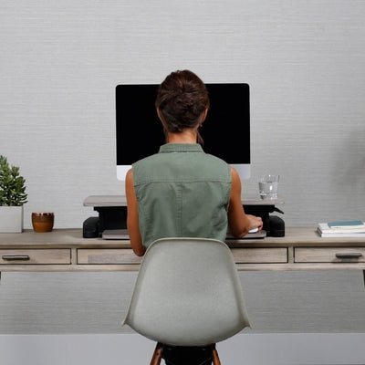 Ergotron WorkFit Z Mini Sit Stand Desktop Front View Sitting